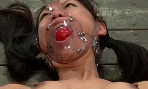 Gagged bound Oriental babe painful