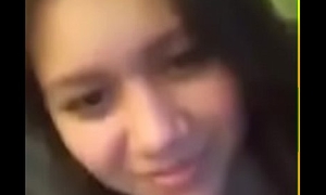 girls kiss adjacent around webcam